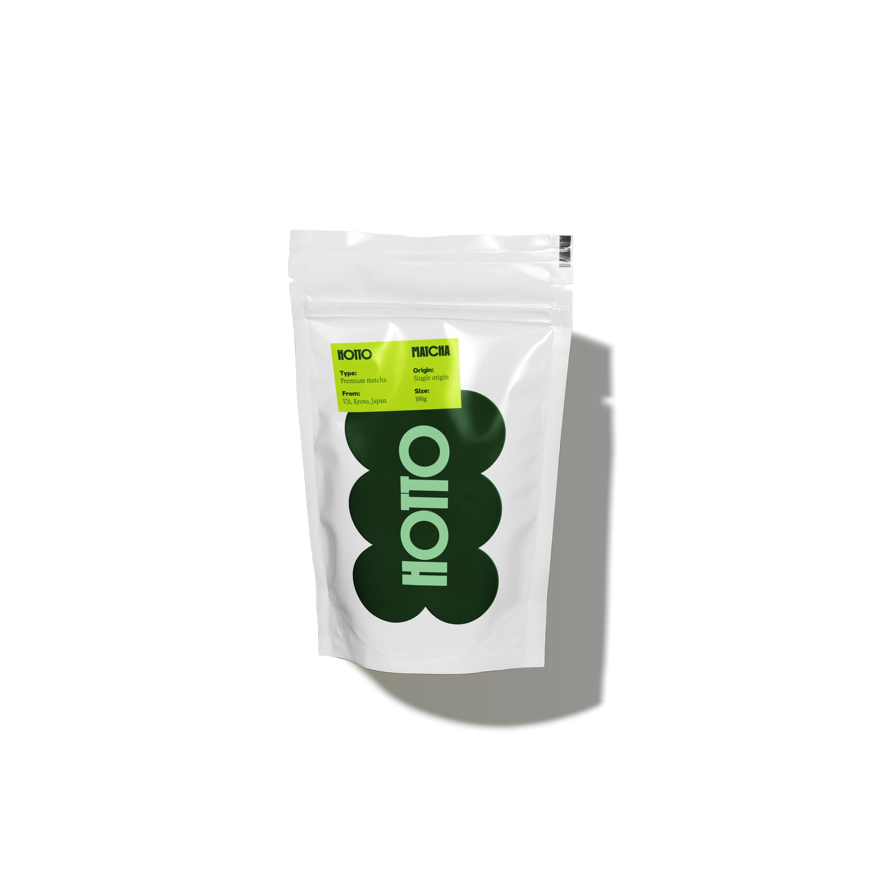 White matcha bag with green and black branding on a white background